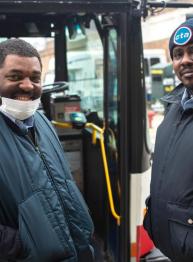 CTA workers standing in front of bus