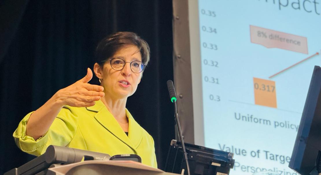 Woman presenting at podium at AFE Conference