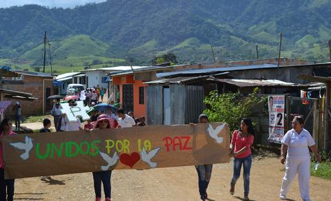 Community members of La Ciudadela in Florencia, Caquetá, Colombia organize a march to support peacebuilding efforts in the Fall of 2015.