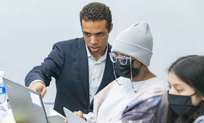 Doug Williams, who double-majors in data science and public policy at the College, mentors high schoolers in his small group.