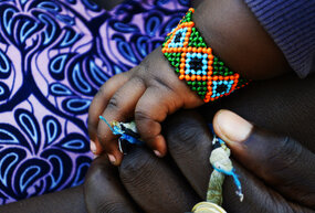 child's hands in mothers' hands