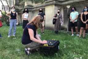 Prof Shannon Lee Dawdy putting final touches on time capsule for her class