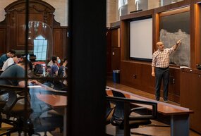 Victor Lima teaching an economics course in Saieh Hall.