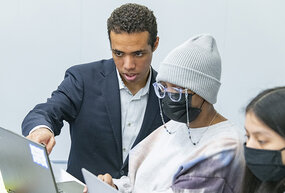 Doug Williams, who double-majors in data science and public policy at the College, mentors high schoolers in his small group.