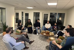 Yangyang Cheng sits with CIR students and CIR AIP Adam Parker